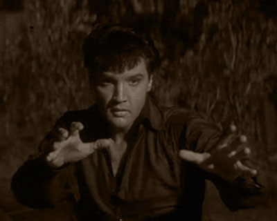 Elvis Presley is Guy Lambert in 1967's DOUBLE TROUBLE (MGM)