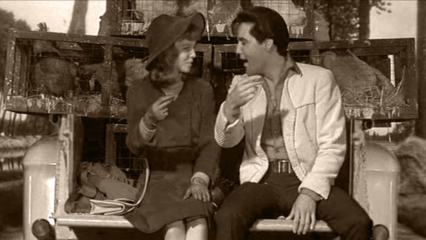 Jill Conway (Annette Day) snaps along as Guy Lambert (Elvis Presley) sings "Old MacDonald" in 1967's DOUBLE TROUBLE (MGM)