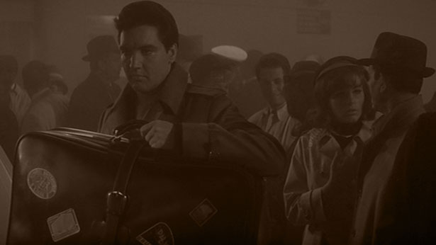 Guy Lambert (Elvis Presley) departs for Belgium in 1967's DOUBLE TROUBLE (MGM)