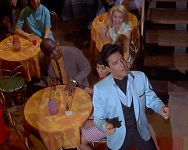 Audience members look on as Mike McCoy (Elvis Presley) sings "Adam And Evil" in 1966's SPINOUT (MGM)